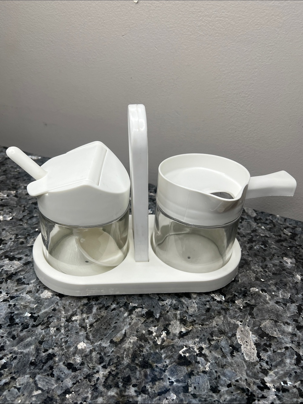 Westinghouse Gemco glass creamer and sugar set with a white plastic caddy